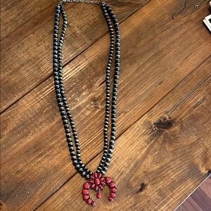 Faux Navajo pearl and red squash blossom